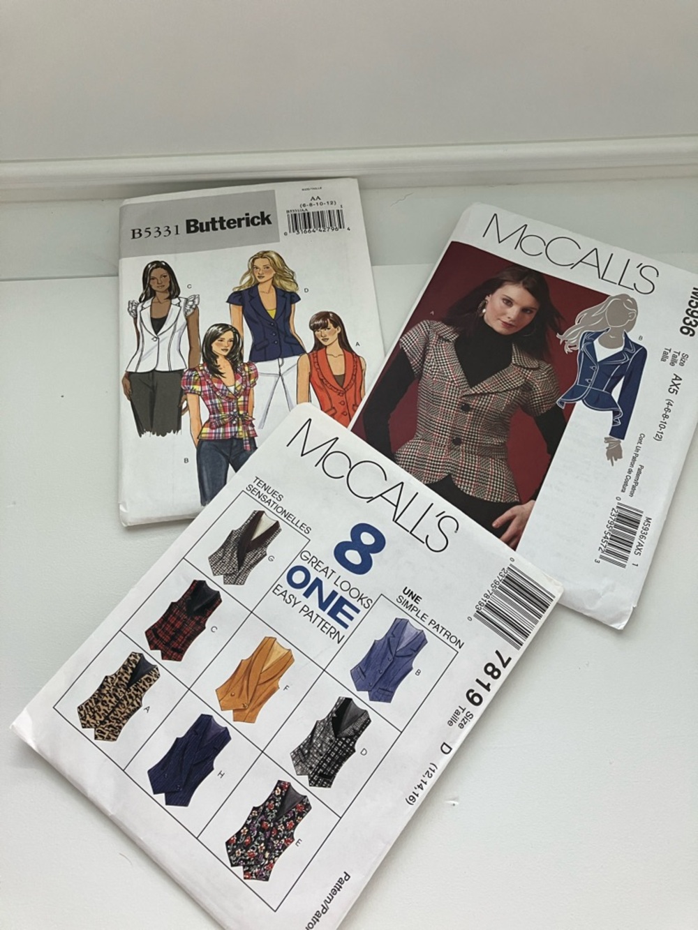 Three uncut sewing patterns women’s short sleeved jackets and vests size is 6–16